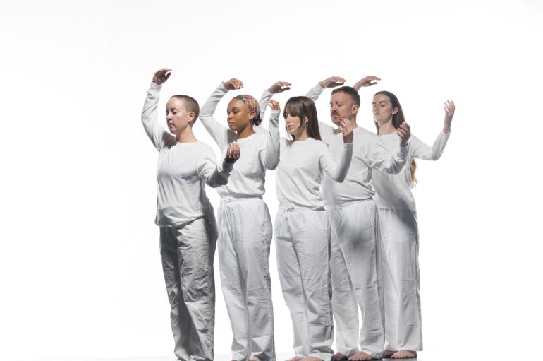 dancers in front of white background